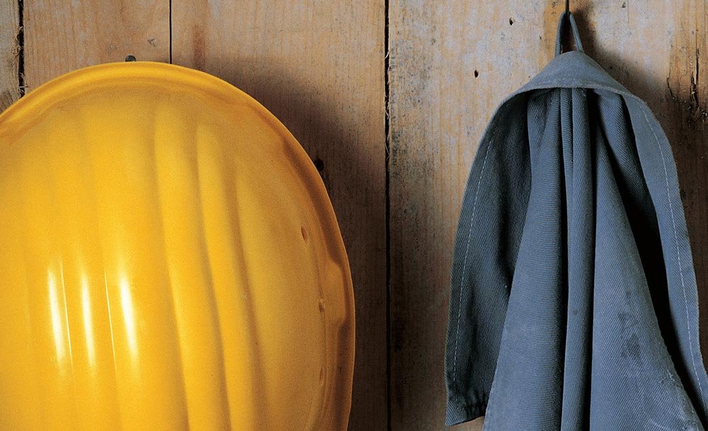 Unfallverhütungsplakat der Suva mit gelbem Helm.